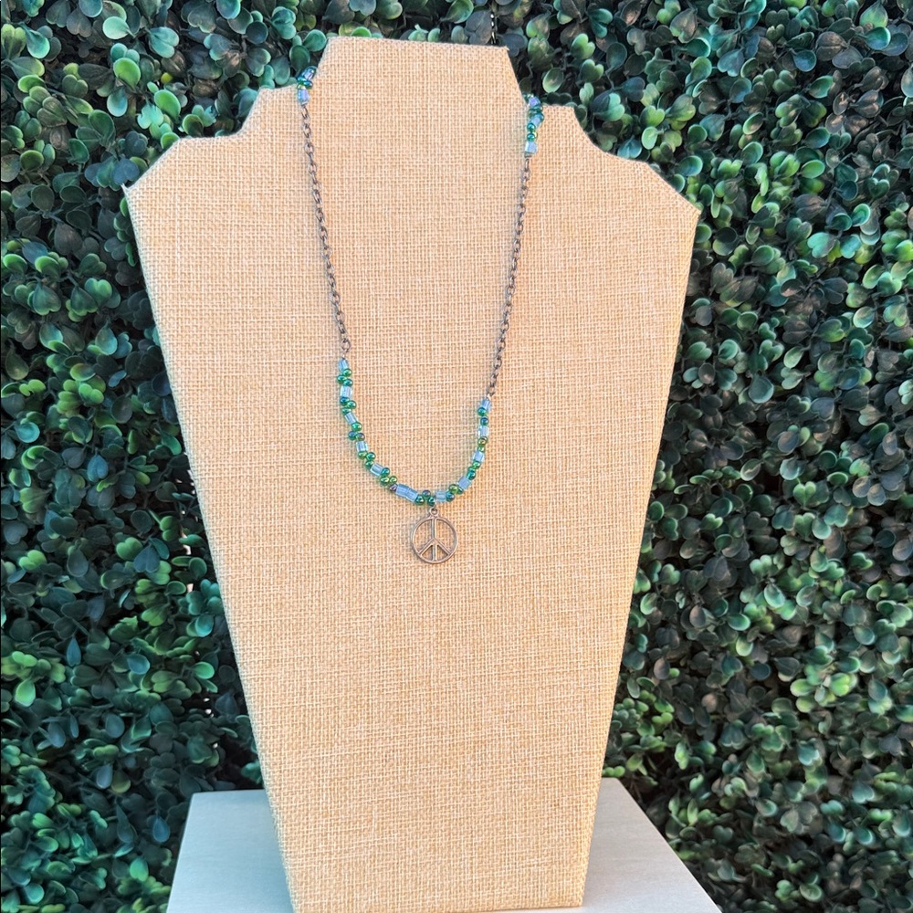 Sterling Tone Peace Pendant Necklace with Green Bead Accents